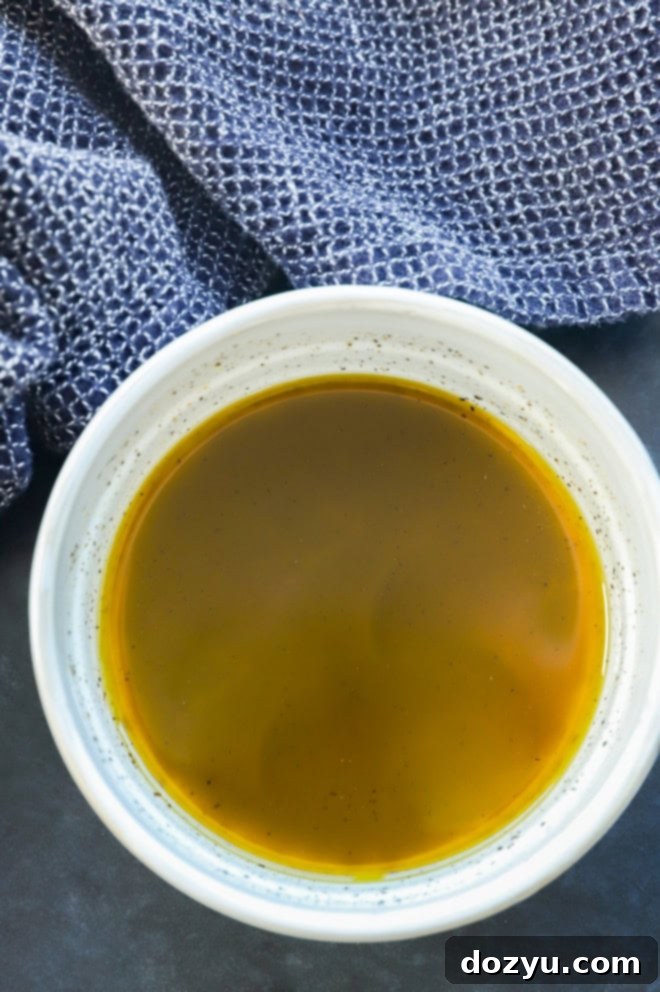 lemon pepper dressing in a bowl with a cloth