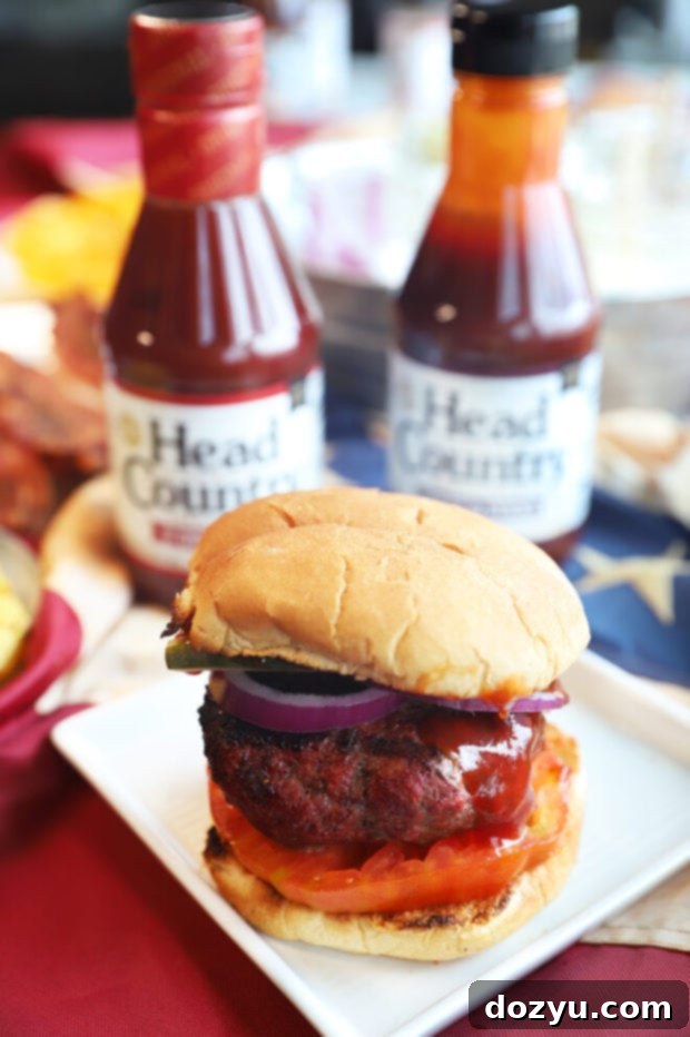 A gourmet BBQ burger assembled with premium toppings