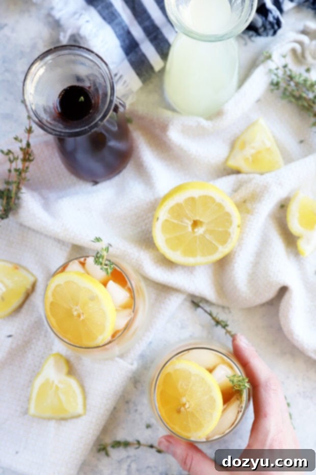 Hand holding arnold palmer drink overhead photo