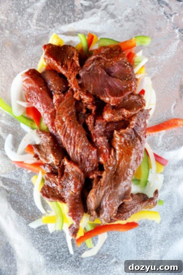 Assembling steak fajita foil packets image