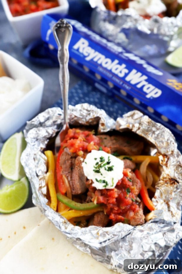 Steak fajita foil packet with fork picture