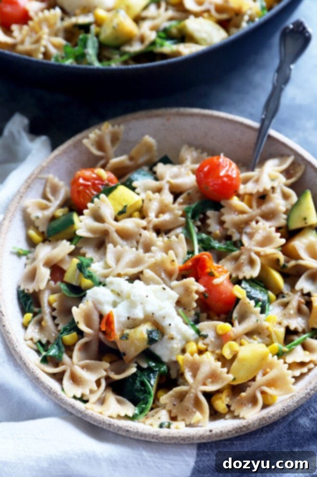 Close-up image of a seasonal dish in a bowl, showing the texture and freshness of the farmer's market pasta.