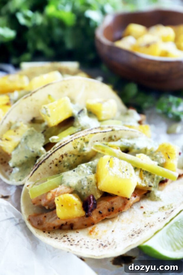 Pinterest optimized image of Sheet Pan Pineapple Chipotle Chicken Tacos.