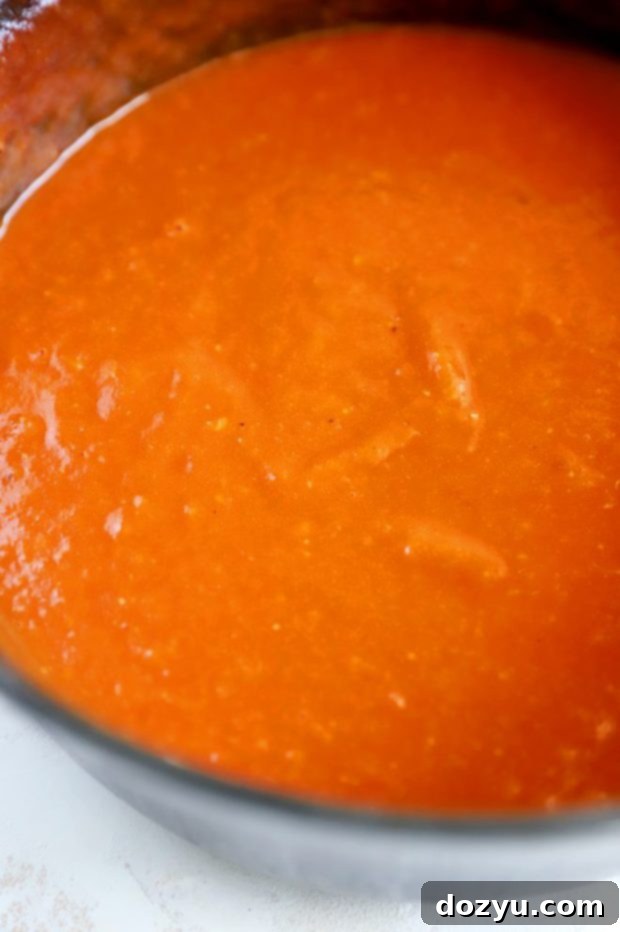 Smooth peach bbq sauce in a pan image