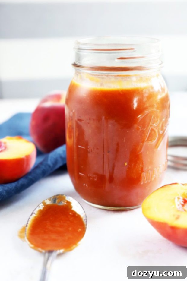 Side photo of peach bbq sauce in a jar