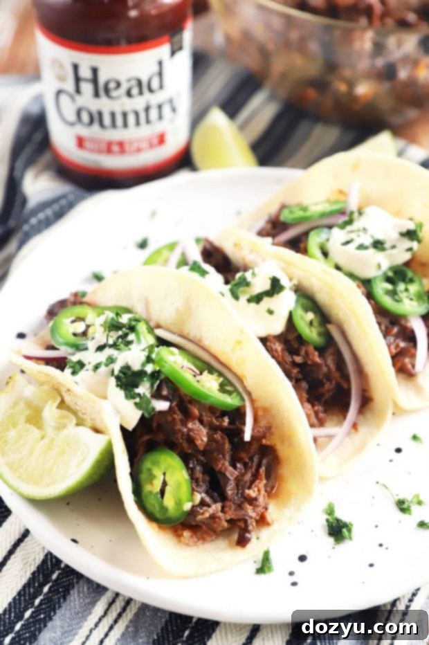 Close-up of Head Country Bar-B-Q tacos with fresh cilantro and red onion