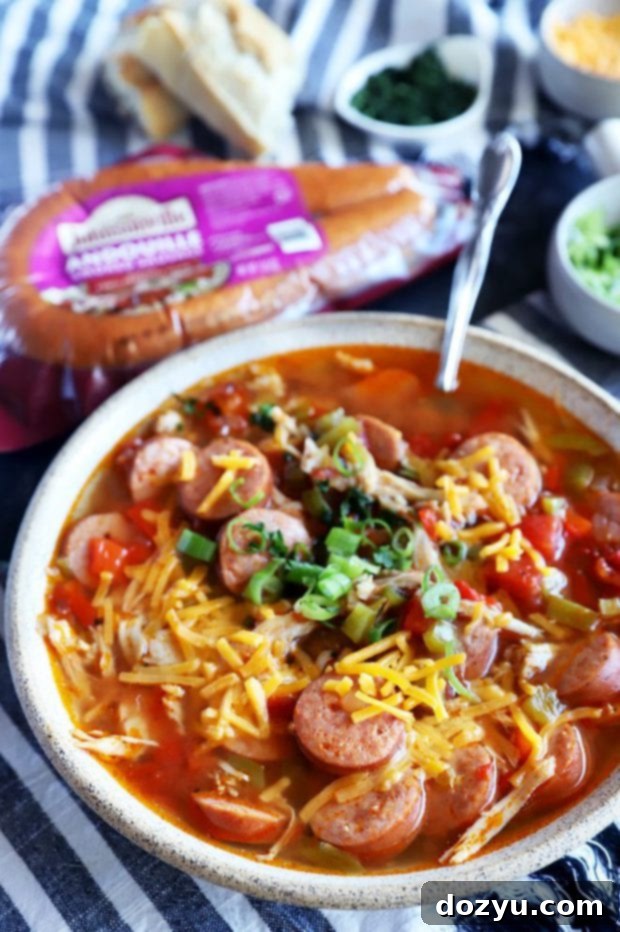 Instant Pot Louisiana Chicken Sausage Soup 2 Overhead shot of a rustic bowl of Instant Pot Creole Chicken Sausage Soup garnished with fresh herbs.