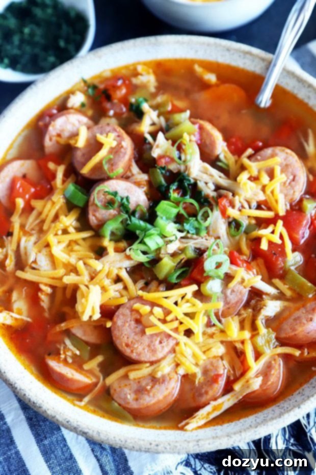 Instant Pot Louisiana Chicken Sausage Soup 4 Close-up photo of Instant Pot chicken sausage soup served in a white bowl, ready to eat.