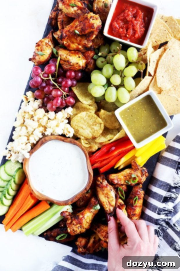 Detailed overhead shot of the chicken wing and snack board, ready for game day festivities