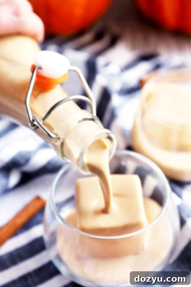 Pouring Irish cream over ice image