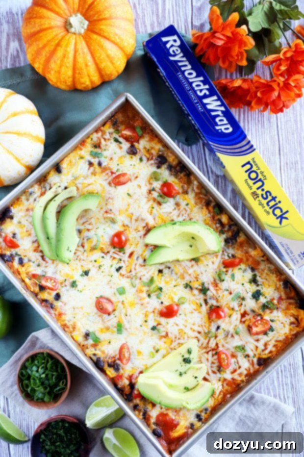 Overhead picture of a slice of enchilada bake with rich, melted cheese