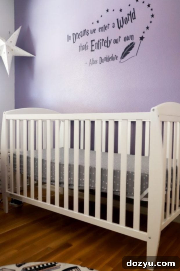 The Harry Potter nursery crib with a unique curved design, adorned with subtle magical elements.