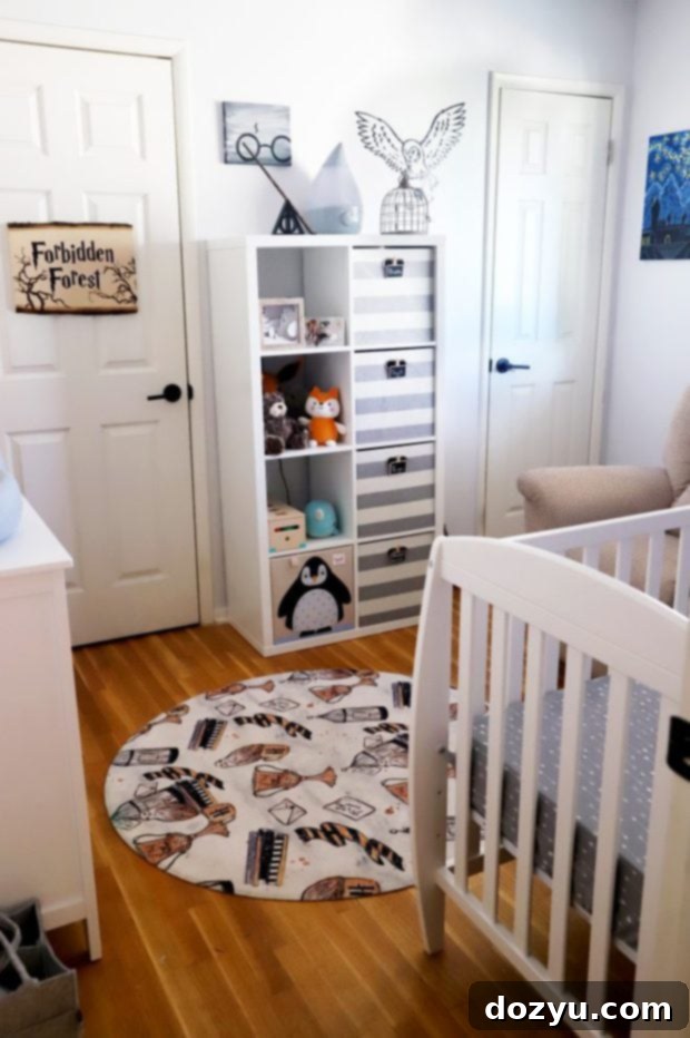 A wide shot of the Harry Potter nursery, showing the crib with Dumbledore quote decal above it and other decor.