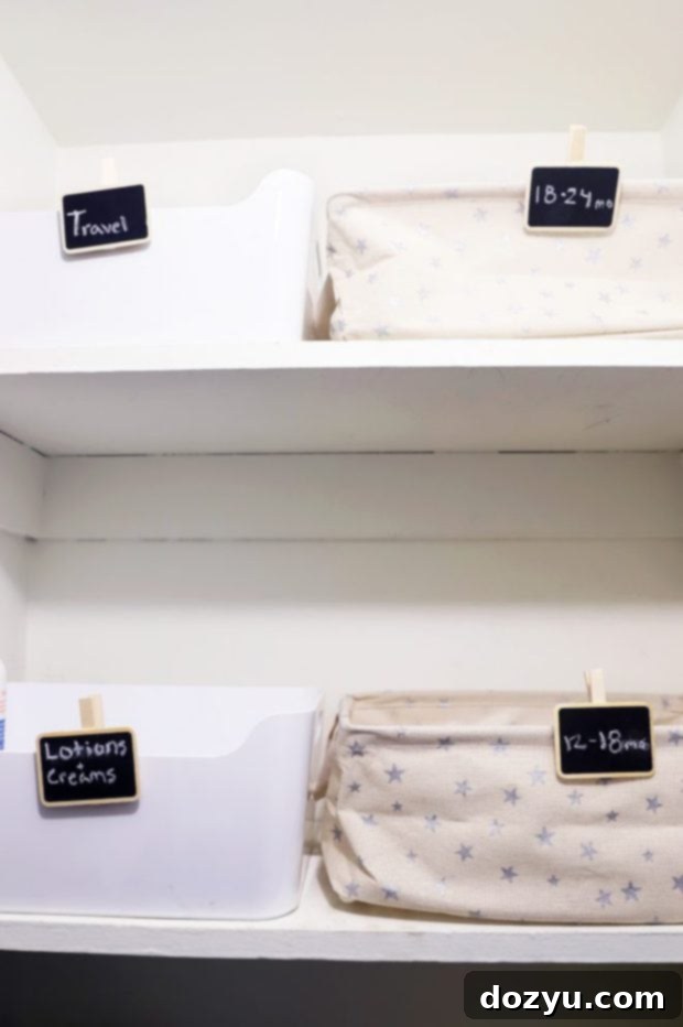 A view inside the organized nursery closet, showing clothes sorted by size in star fabric bins and other storage.