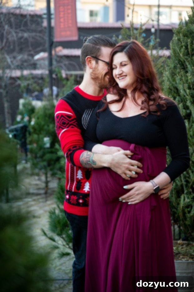 Maternity photo at Little Man Ice Cream featuring the expectant couple