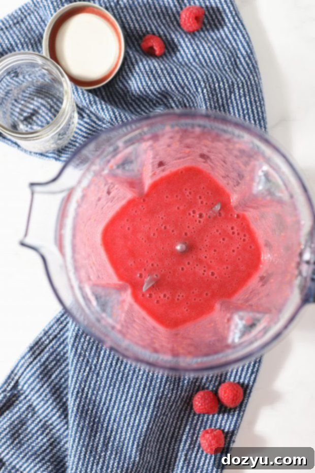 Brunch Bliss Raspberry Mimosa 6 Image showing the process of making raspberry simple syrup in a saucepan