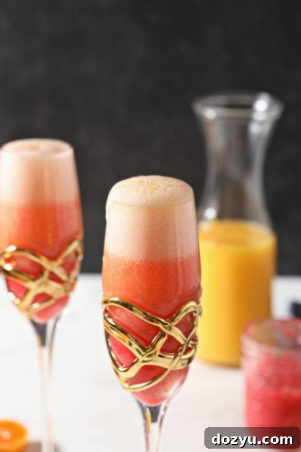 Brunch Bliss Raspberry Mimosa 8 Full glass of raspberry mimosa garnished with fresh raspberries