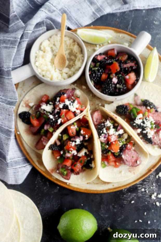 Overhead image of blackberry steak tacos