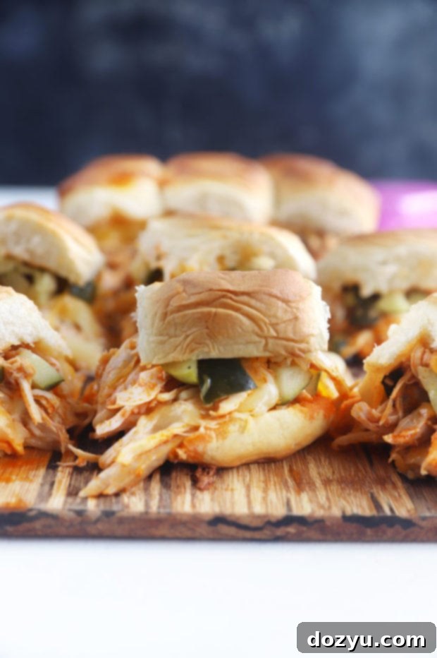 A tray of freshly baked pickle brined hot chicken sliders, ready to serve