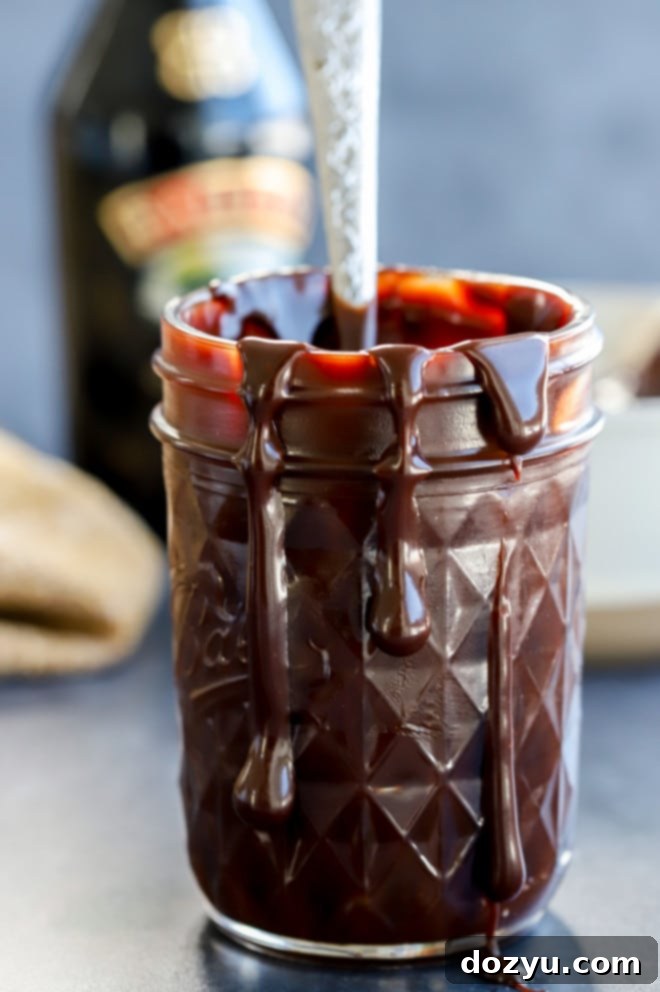 Baileys hot fudge sauce in jar with spoon
