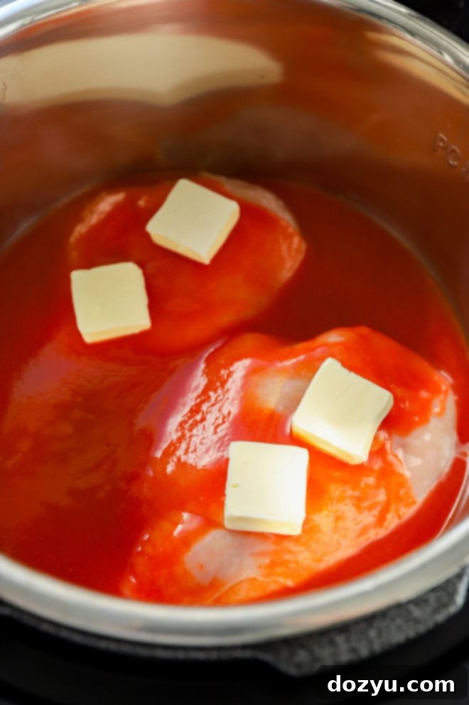 chicken in instant pot with buffalo sauce and butter