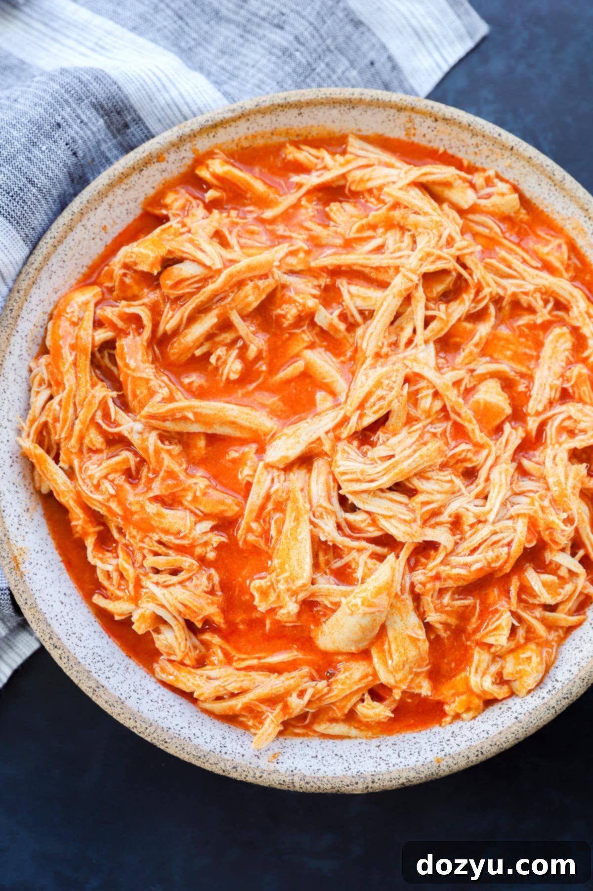 Instant Pot Buffalo Chicken in a bowl with napkin