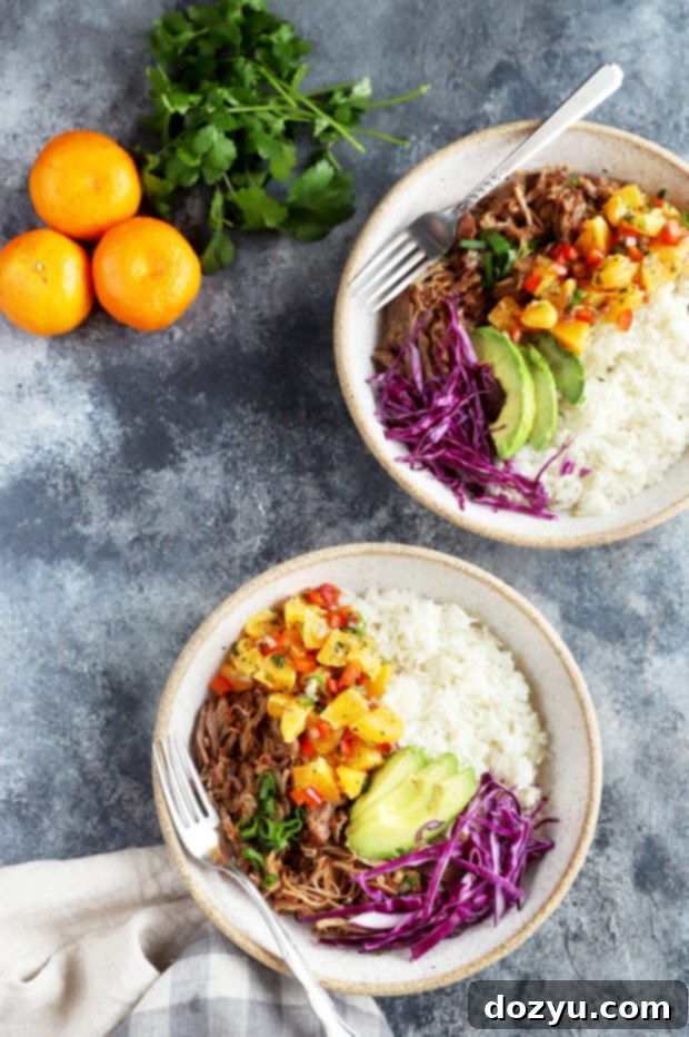 Sweet and Tangy Teriyaki Pulled Pork Bowls with Mandarin Salsa 2 Overhead photo of beautifully arranged Instant Pot Teriyaki Pulled Pork Bowls with rice and fresh toppings