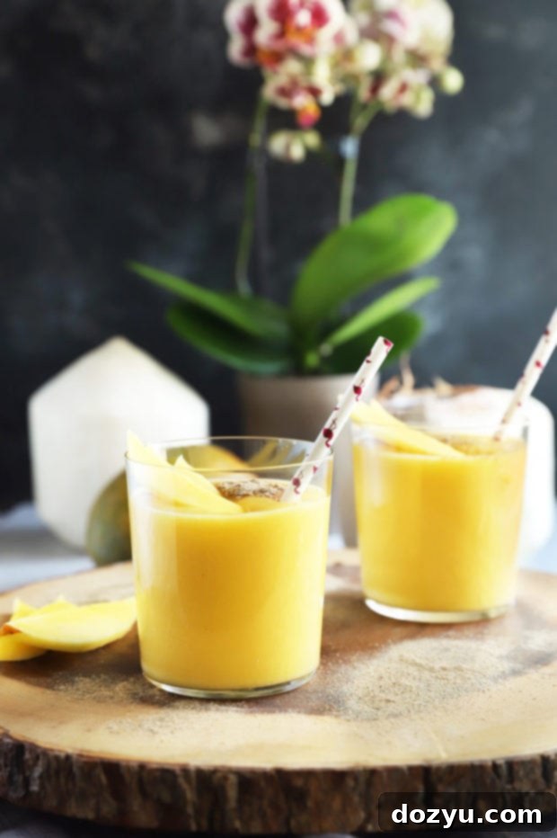Tropical Mango Coconut Bliss 3 Side view of mango smoothie in glasses image