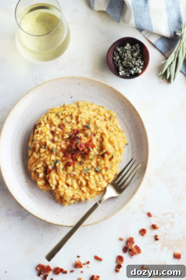 Close-up of creamy butternut squash risotto served on a plate, showing the texture and ingredients.