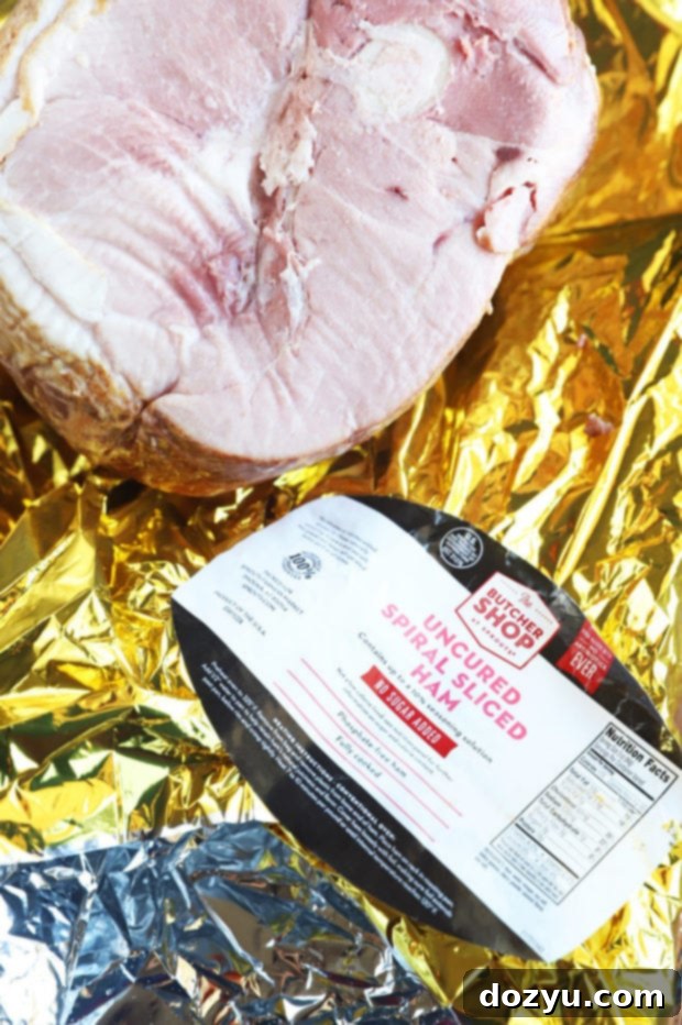 A high-angle shot of a Sprouts No Sugar Uncured Spiral Sliced Ham on a cutting board, with slices removed, indicating it's ready for holiday meals or leftovers.