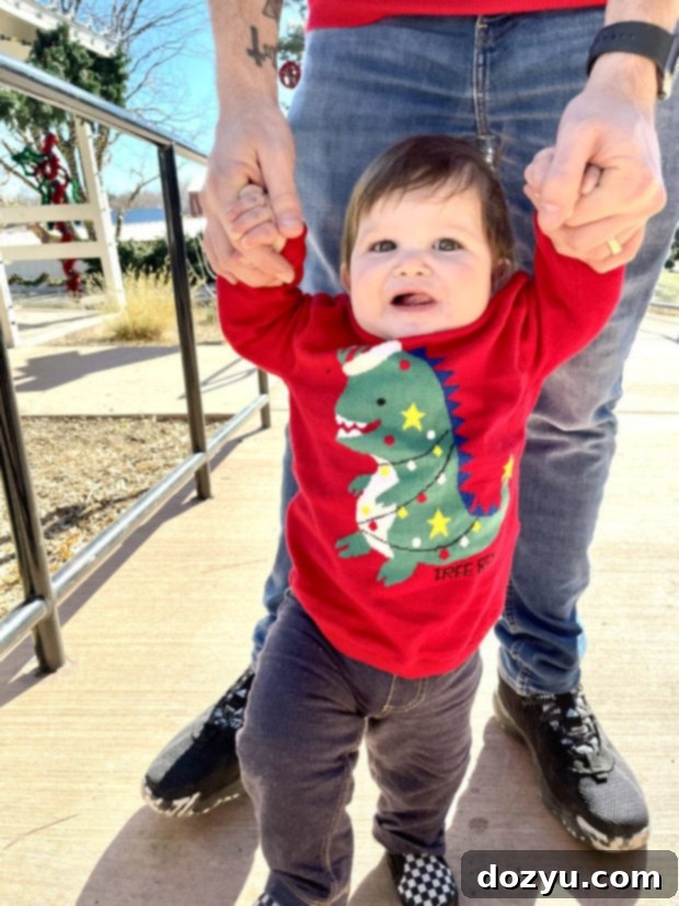Monthly Scoop 2 Adorable baby celebrating first Christmas amidst festive decorations