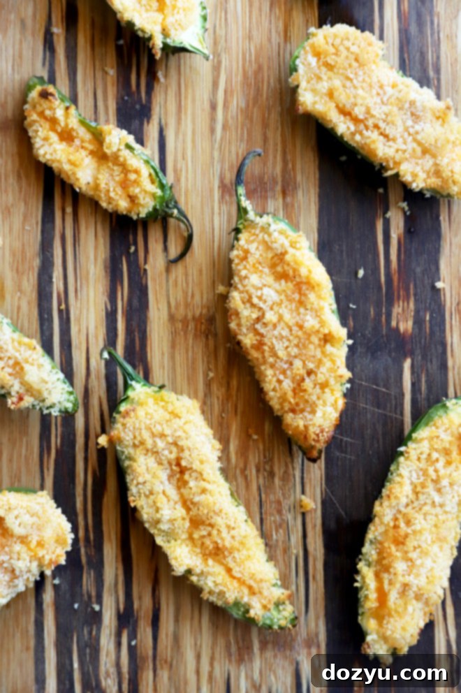 Image of jalapeno poppers on platter, garnished with parsley