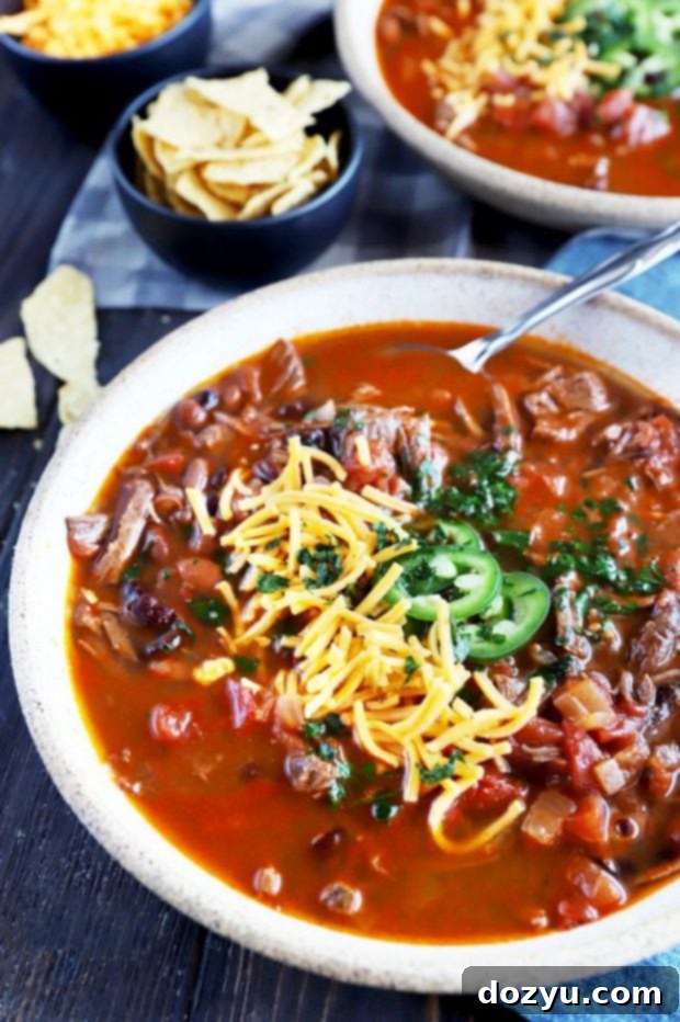 Side view of a bowl of spicy Instant Pot carne asada chili