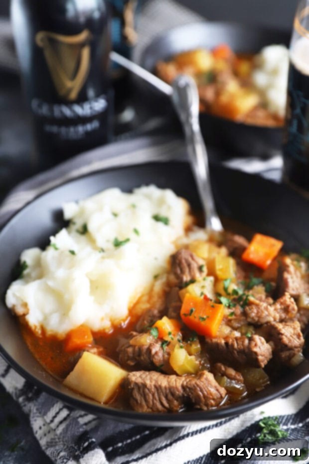Hearty Instant Pot Irish beef stew with potatoes in a rustic bowl