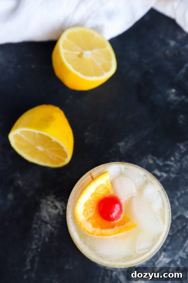 Overhead perspective of a perfectly crafted Jameson Whiskey Sour cocktail, highlighting its vibrant color and elegant garnish.