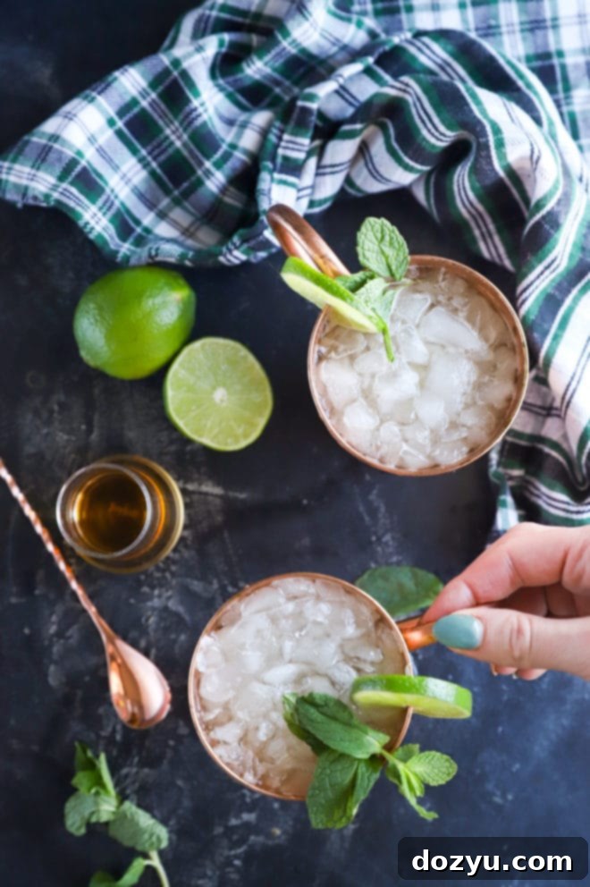 Hand holding copper mug for moscow mule