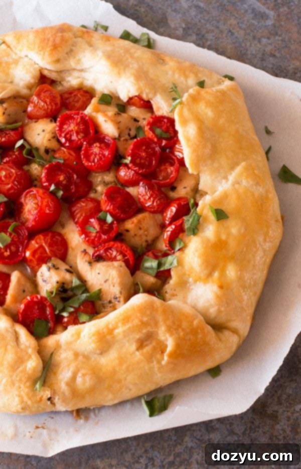 Savory Chicken Caprese Galette on a cutting board, ready to be served