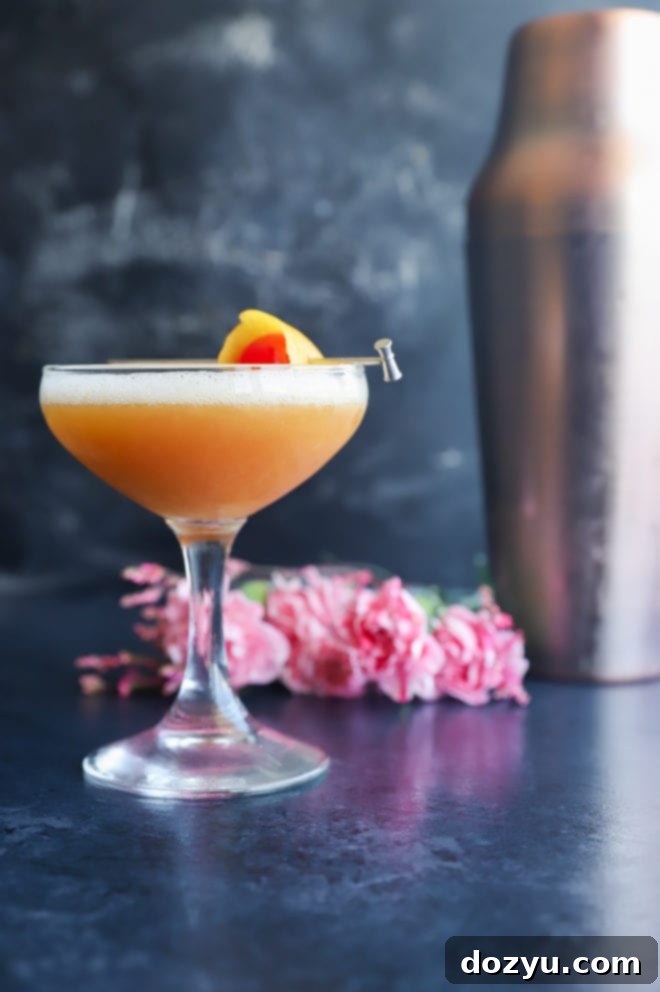 Boston's Spirited Zest 4 Side view of a elegant Boston Sour cocktail in a coupe glass, highlighting the foam layer.