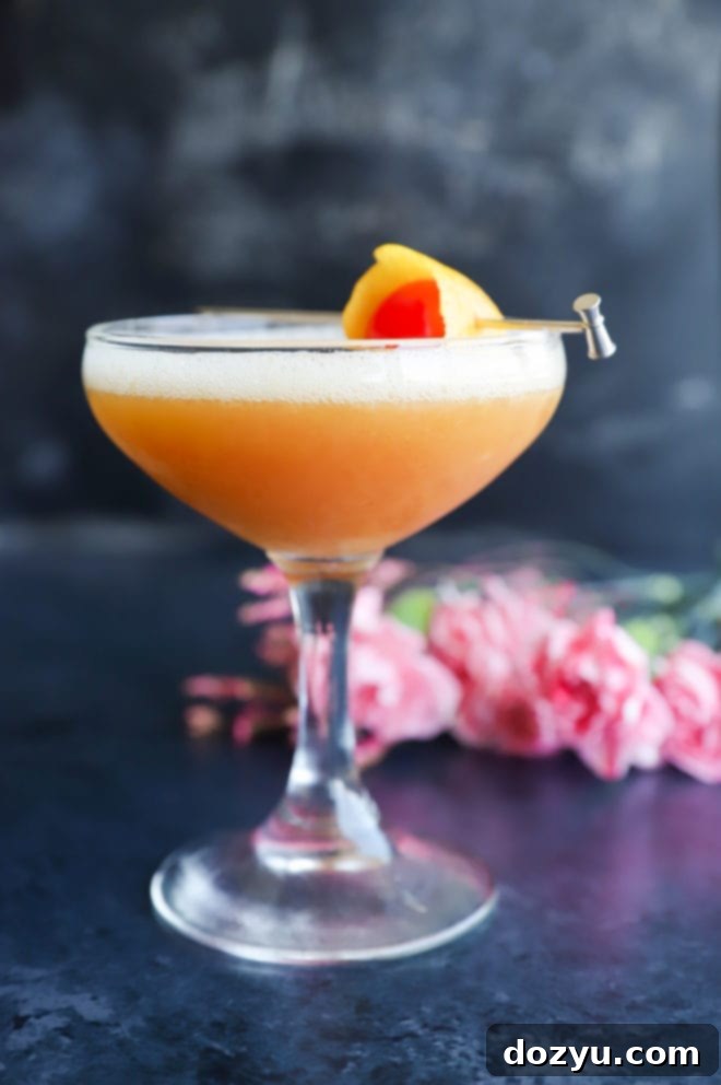 Boston's Spirited Zest 6 Front view of a beautifully presented Boston Sour cocktail with a frothy top and lemon garnish.