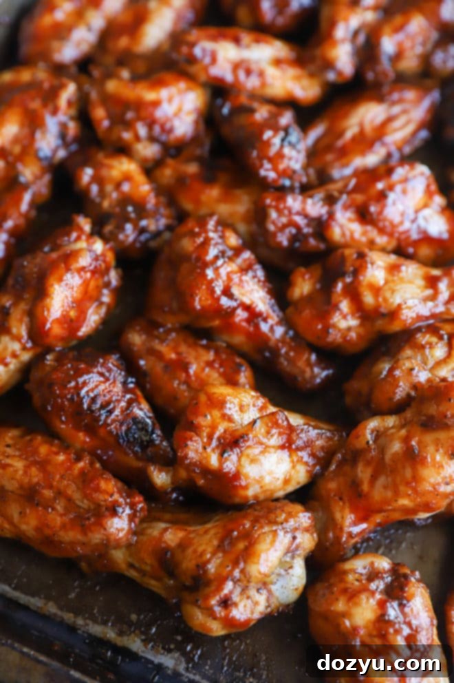 Sticky Honey BBQ Grilled Wings 9 Grilled chicken wings on platter image