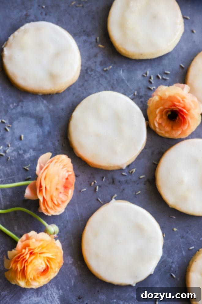 Lemon Lavender Shortbread Delights 5 An inviting overhead view of a tray of freshly baked lemon lavender cookies, arranged neatly for a beautiful presentation.