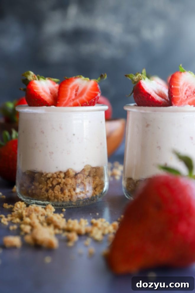Side view of jars with mousse in them and crumble