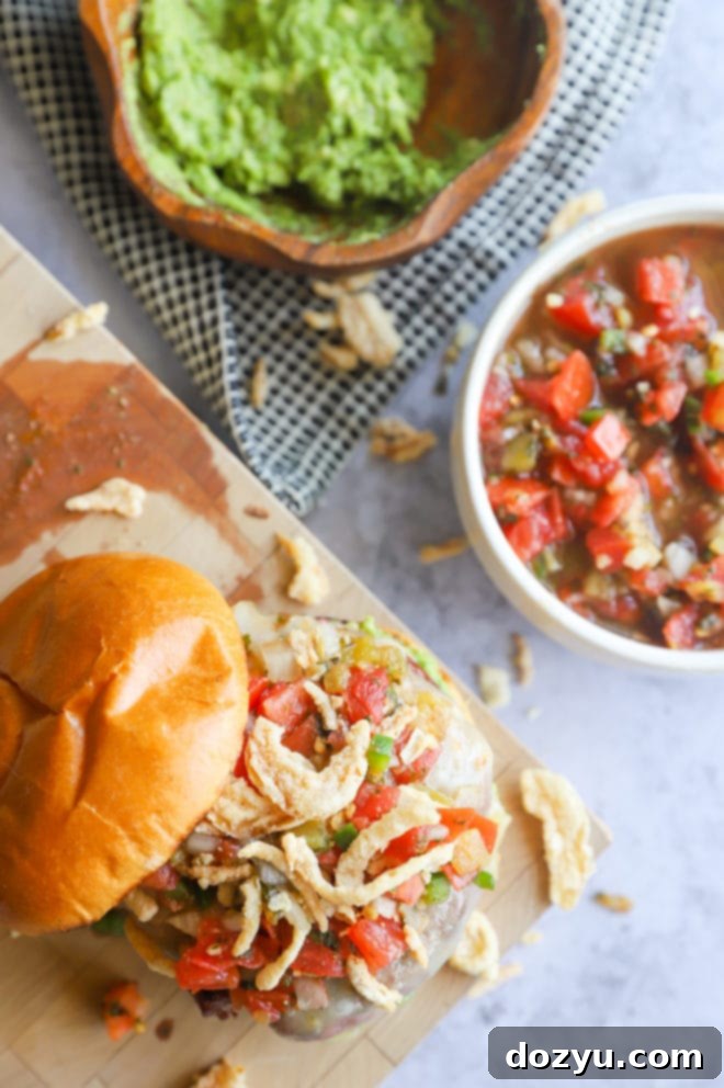 Image of salsa burger on block with avocado and salsa