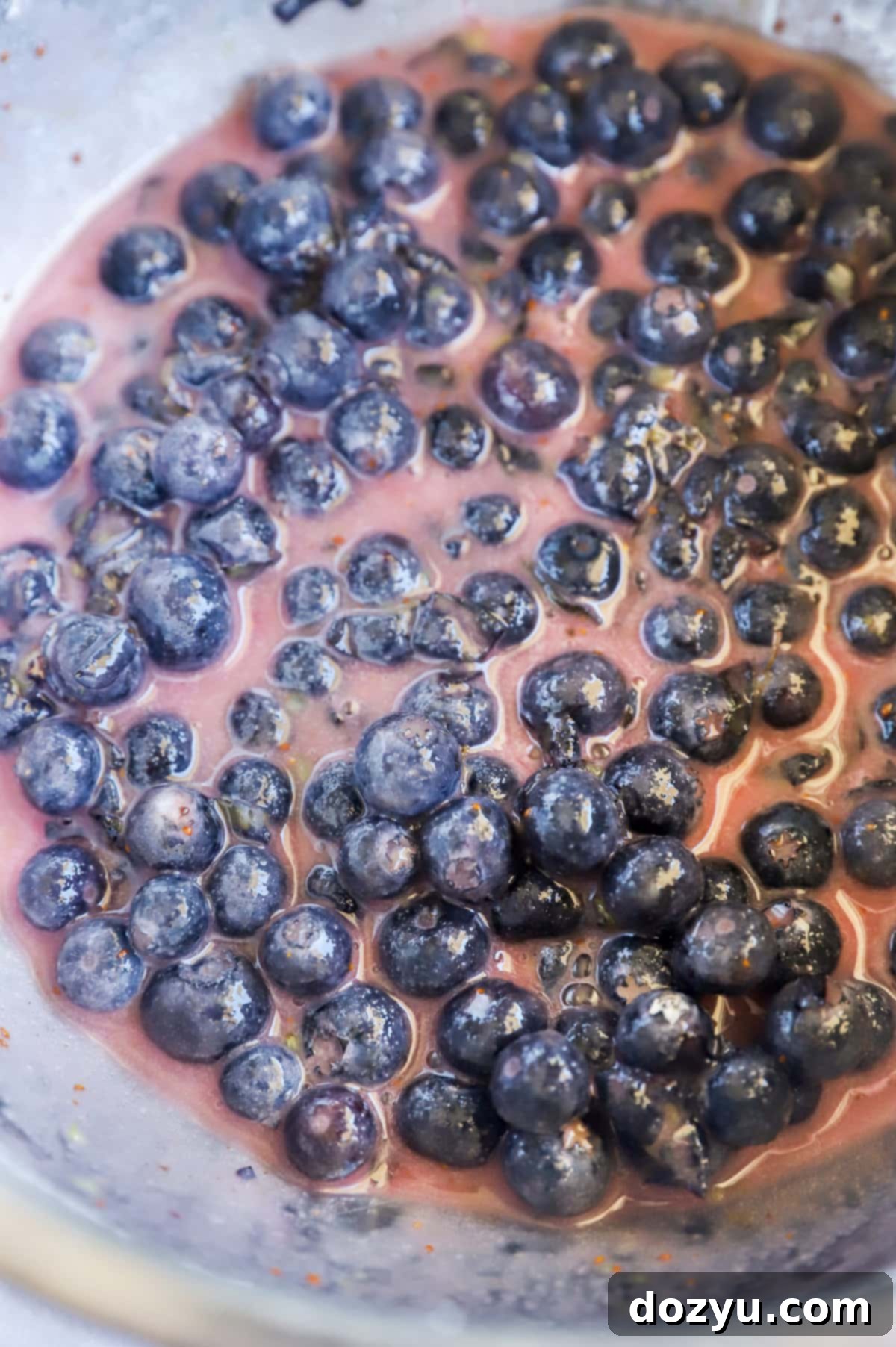 Blueberry pie filling in a mixing bowl, ready for assembly