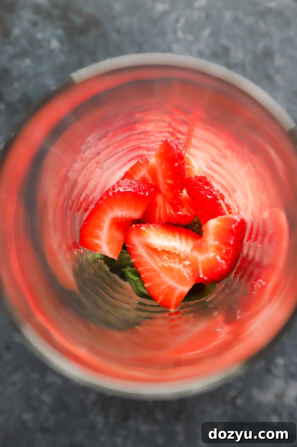 Cocktail shaker with muddled ingredients and tequila ready to be shaken