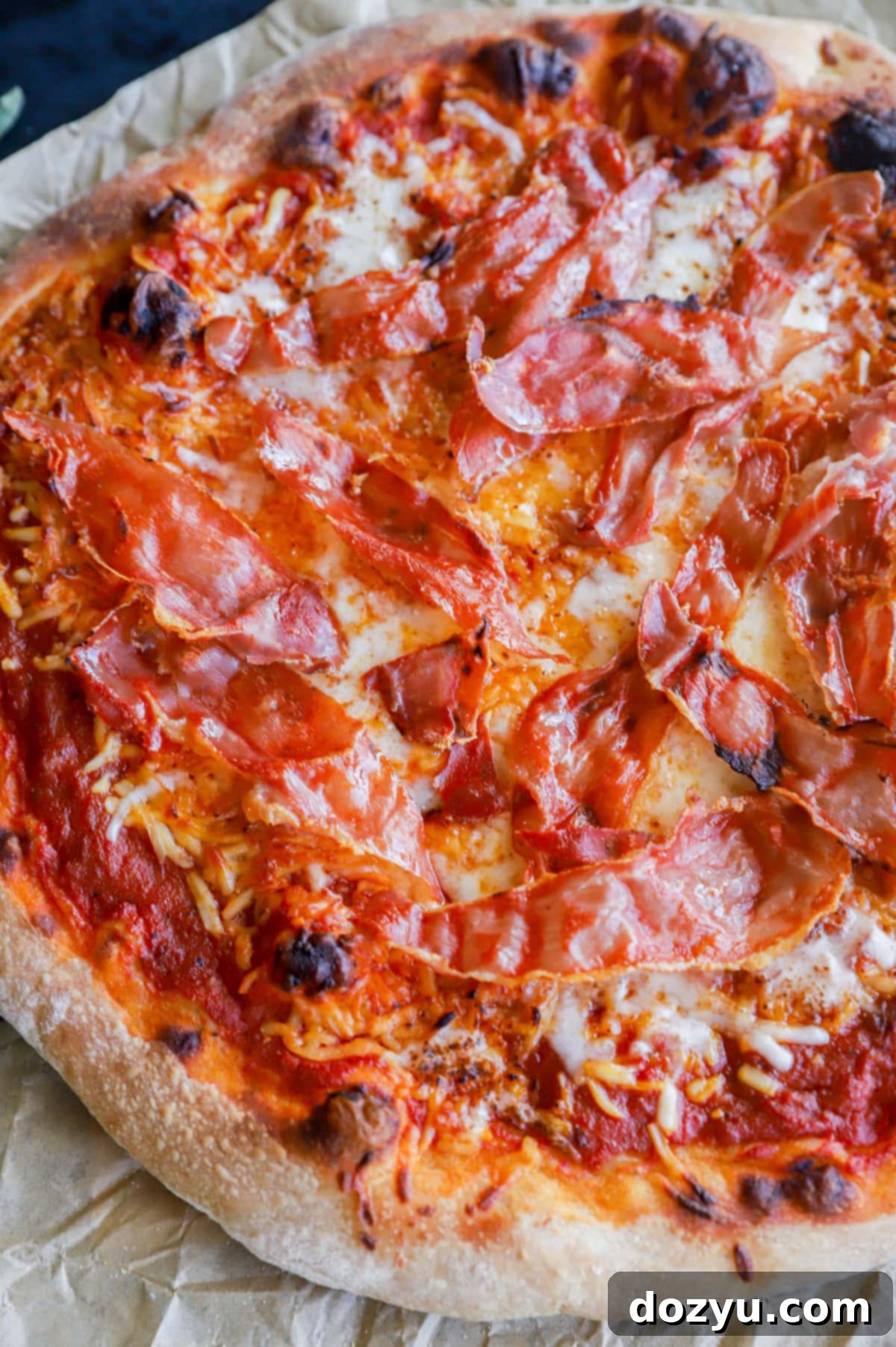 Pizza dough being stretched and prepared