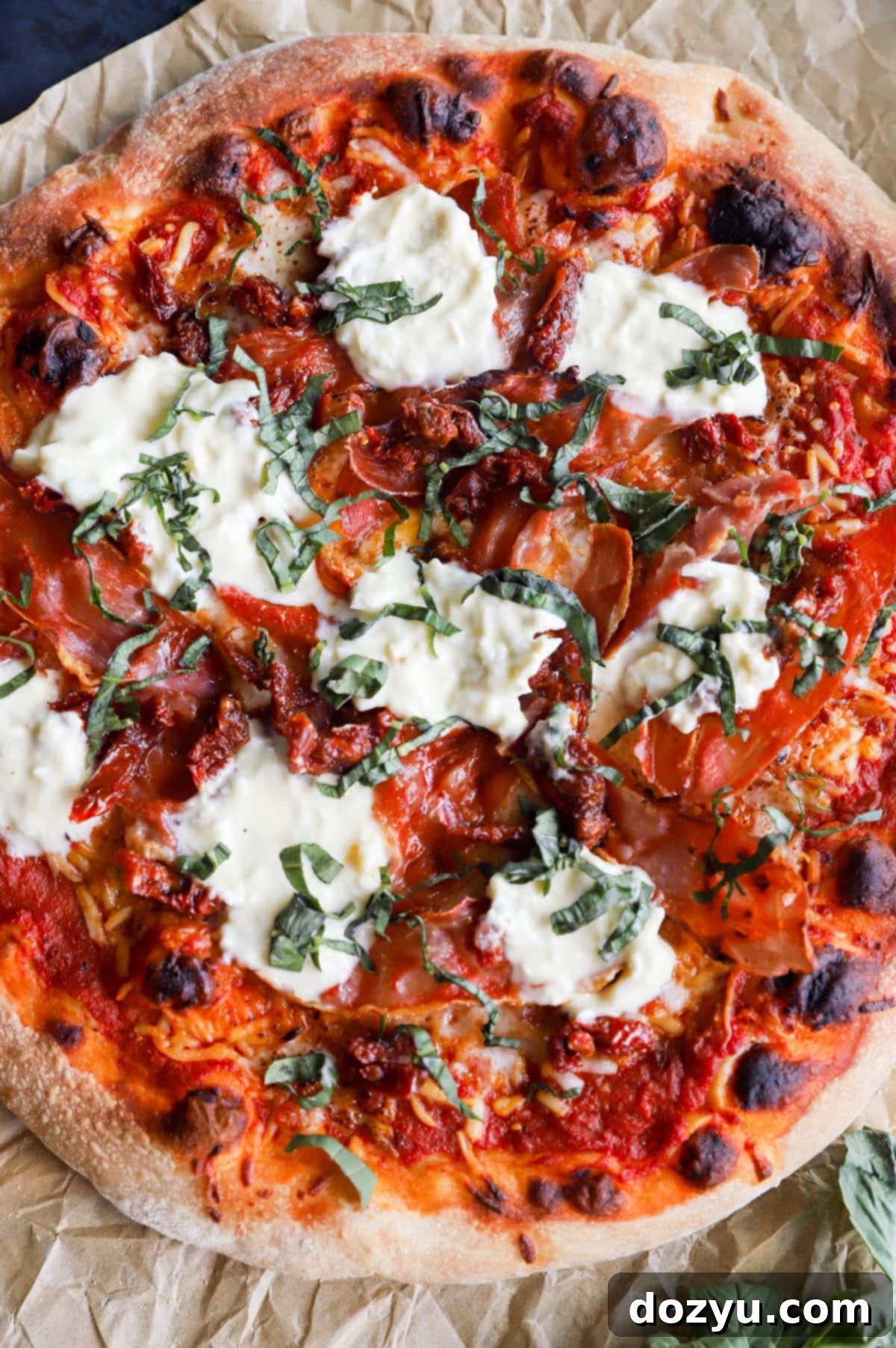 Finished grilled pizza with crispy prosciutto