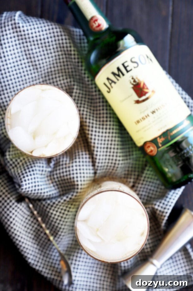 Overhead view of Jameson and Ginger cocktails in glasses, showing the vibrant lime wedge garnish.