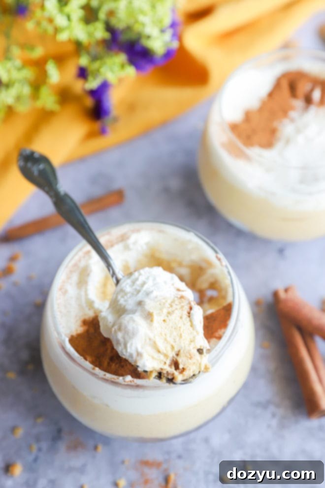 Image of a spoon with cheesecake mousse, showcasing its creamy texture