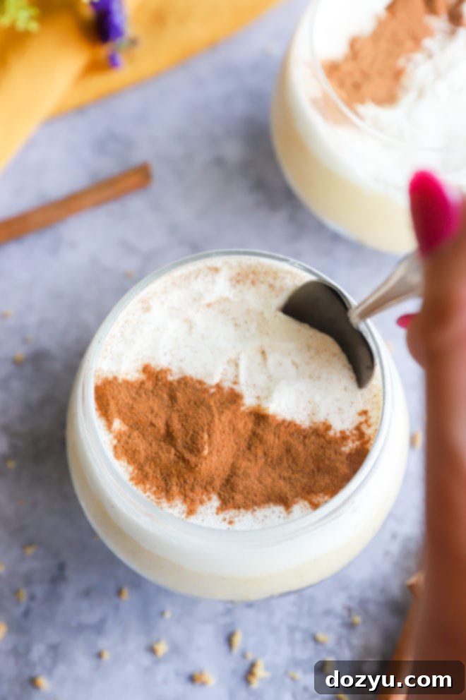 Spoon taking a spoonful of pumpkin spice cheesecake mousse